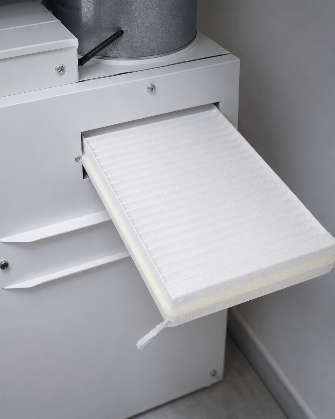 Ventilation filter being removed from an air handling unit